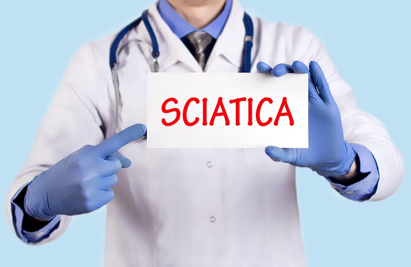 Doctor keeps a card with the name of the diagnosis – sciatica.